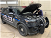 Checking under the hood of a Police Car