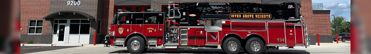 Website Banner Photo showing IGH Fire Department Truck and Station