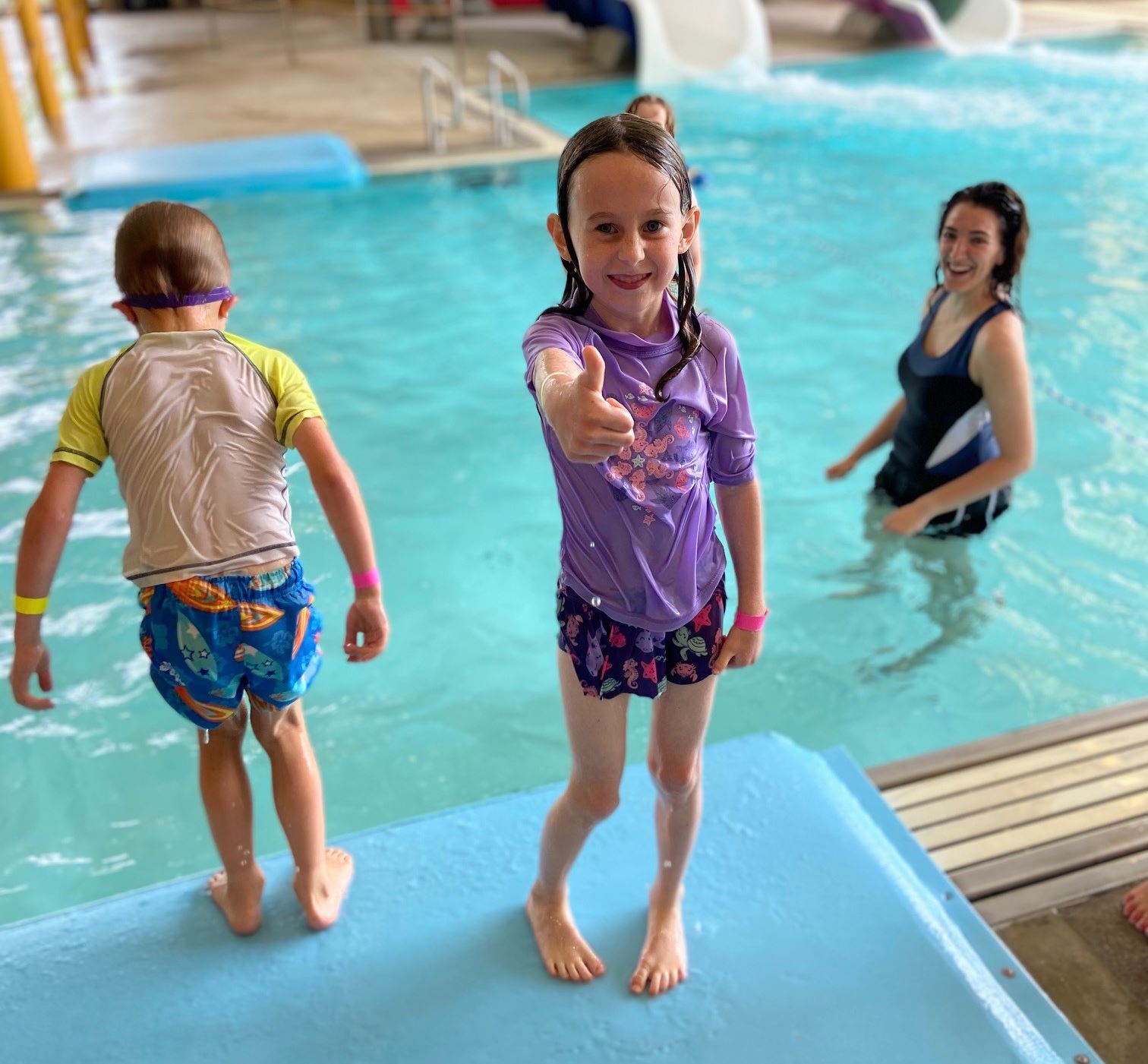 Image of girl at the pool giving thumbs up during Kids ROCK