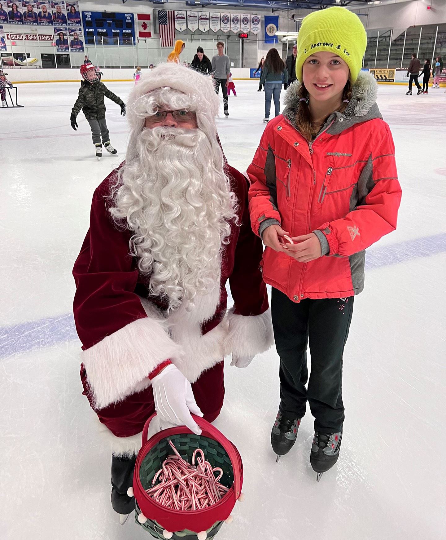 Photo of girl and Santa on skates