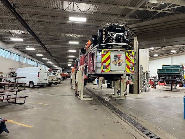 Fire Engine on Lift Seen From Behind 1