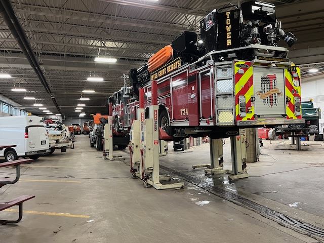 Fire Engine on Lift Seen From Behind 2