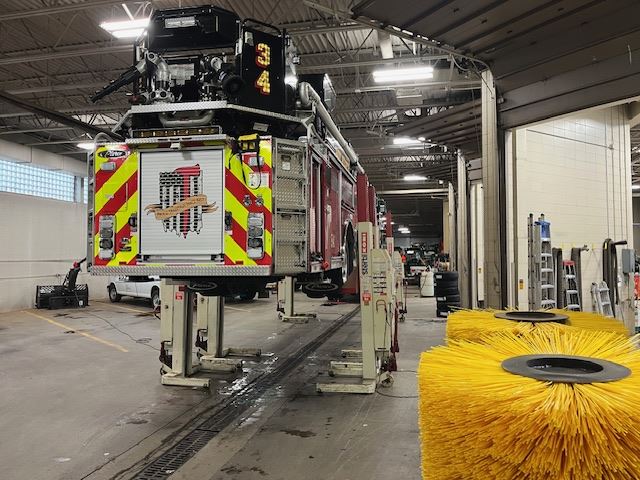 Fire Engine on Lift Seen From Behind 3