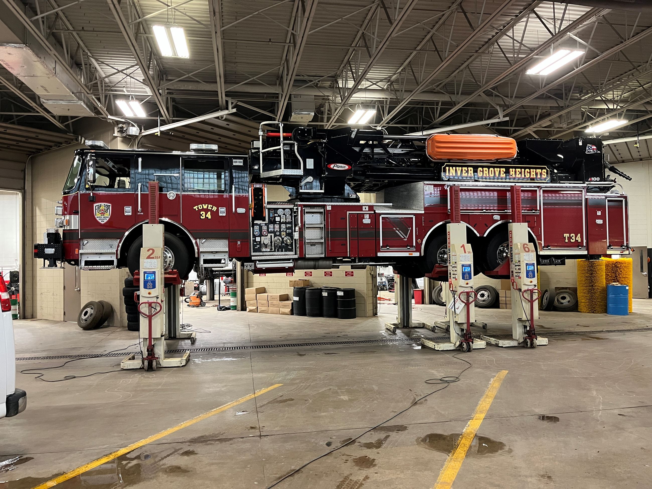 Side view of a Fire Truck on a Lift